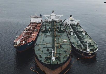 Three oil tankers moored at sea